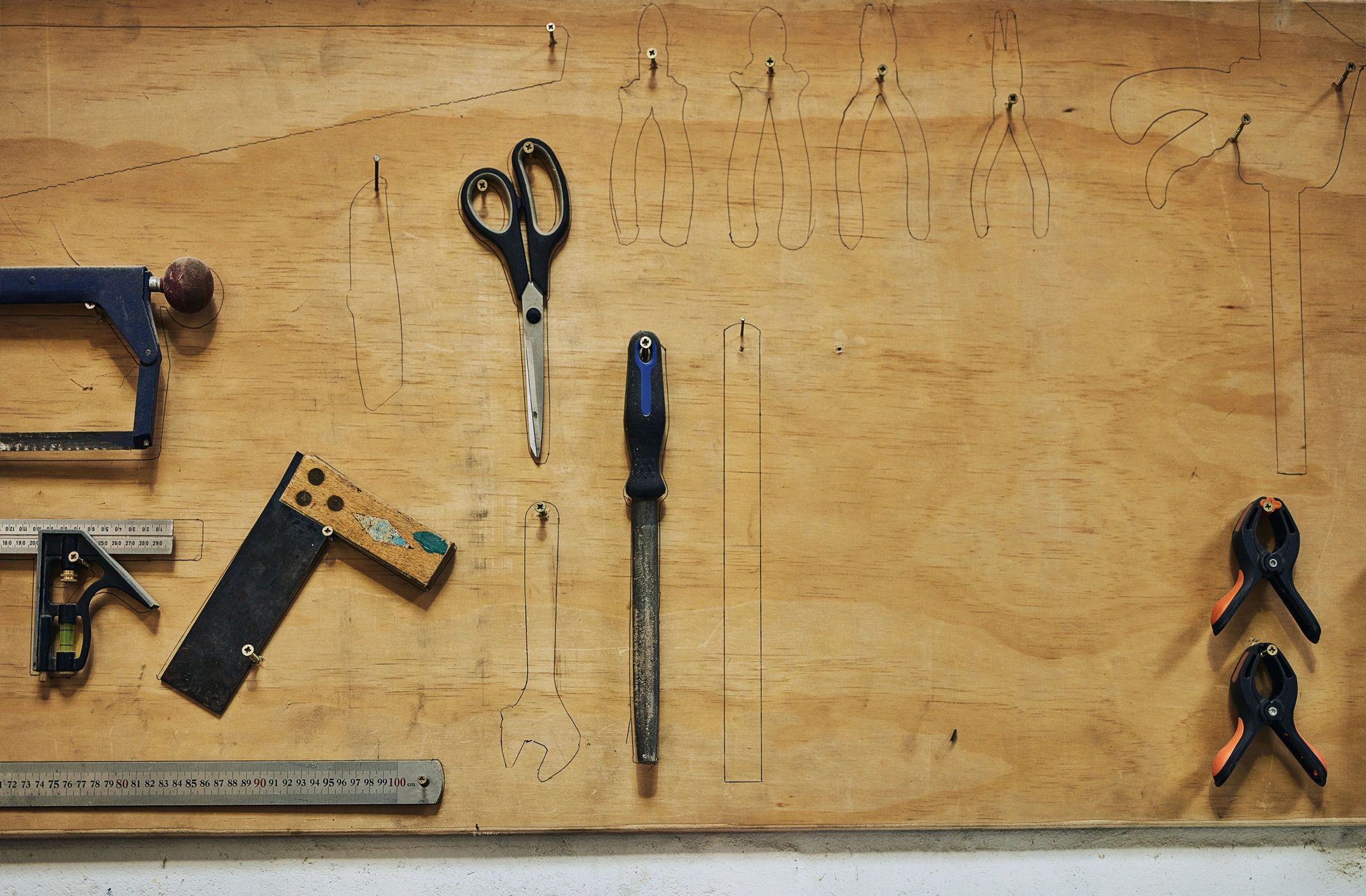 Hand tools arranged in a workshop