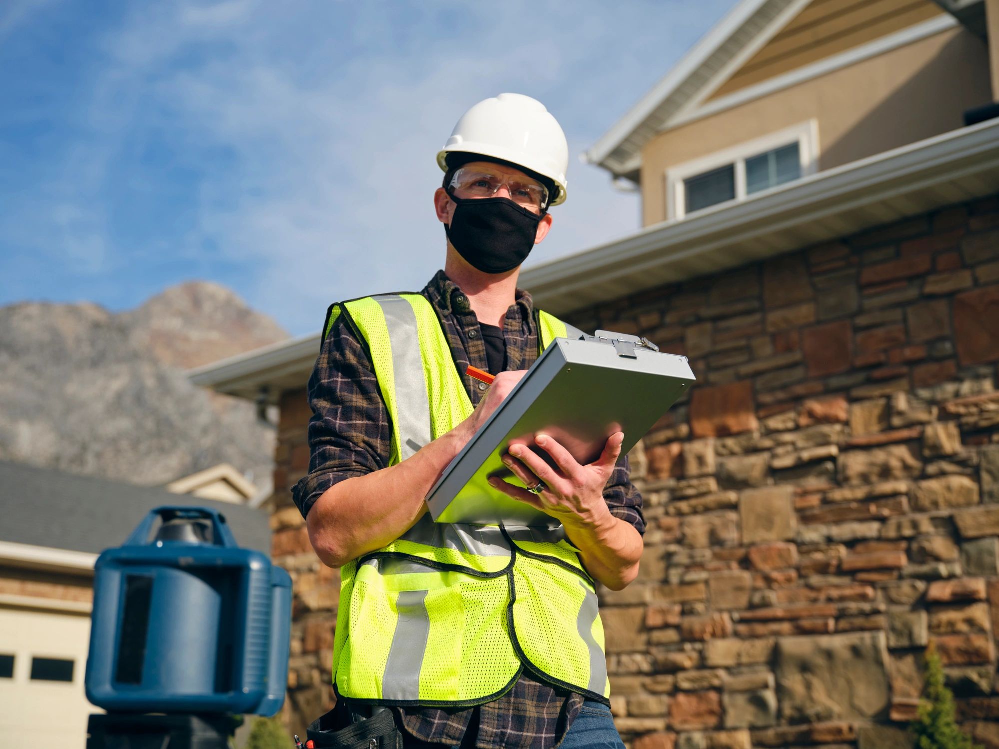 Technician performing exterior home repair work
