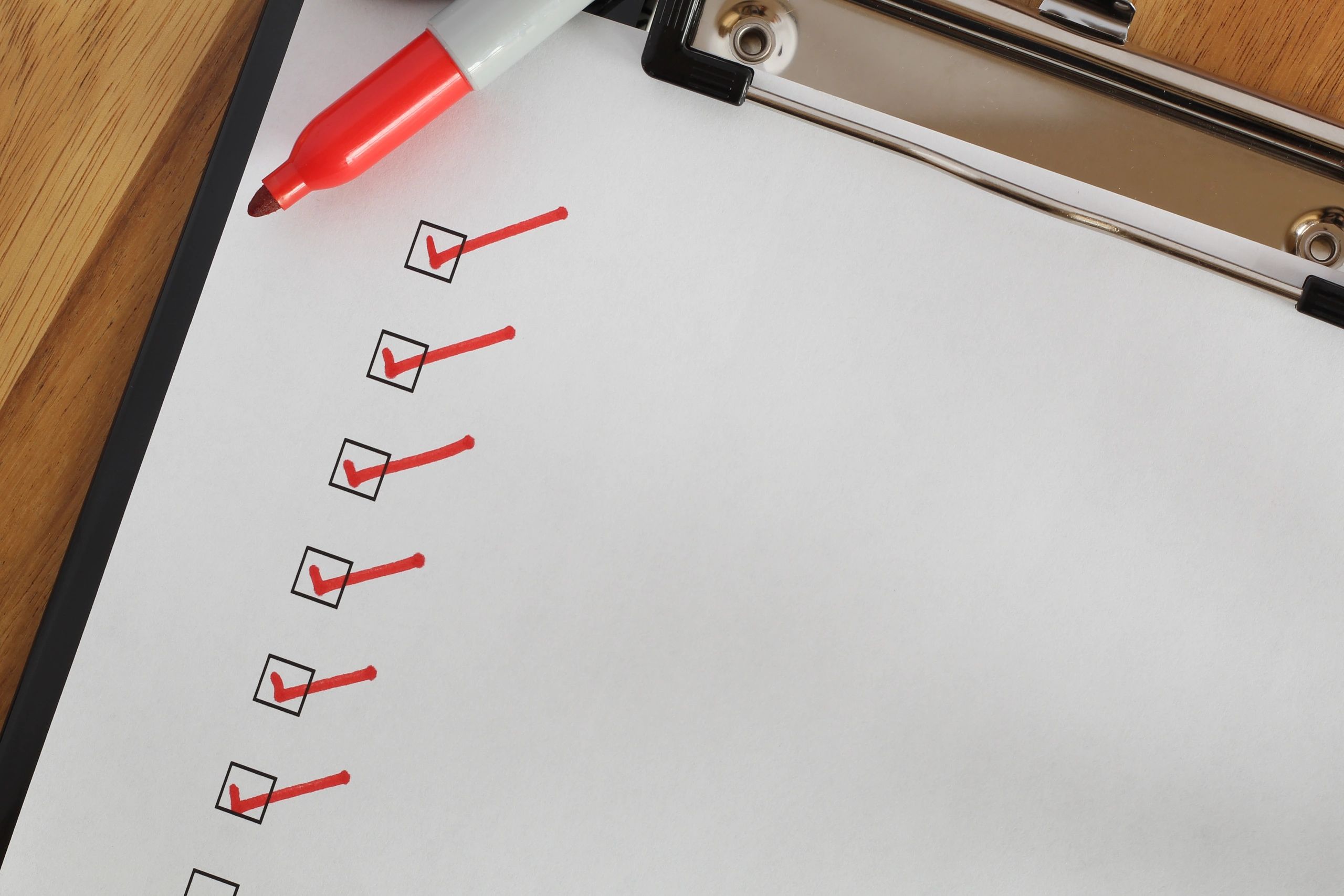 Checklist with red check marks